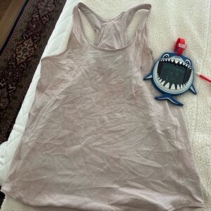Lululemon tank. Pink and white. Size 8. No tags.